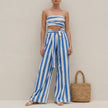 Blue striped two-piece women's co-ord set with ruched detailing from FJØRNA, styled for elegant casual wear.