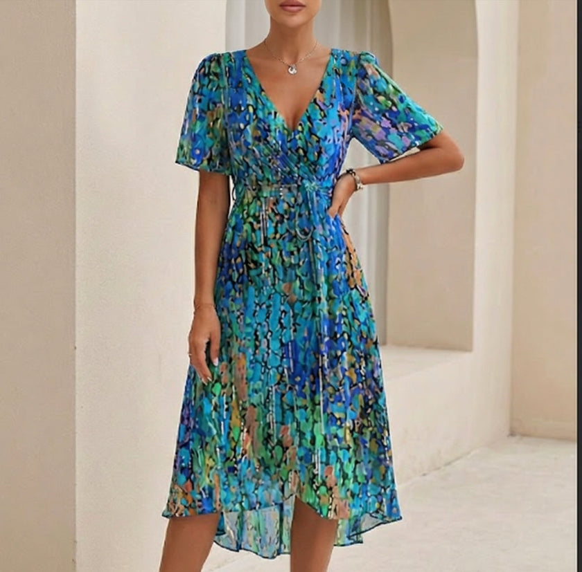 Blue FJØRNA elegant midi dress for women with v-neck, short sleeves, and wrap style, perfect for sophisticated occasions.