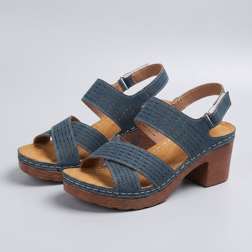 FJØRNA orthopedic platform block heel sandals with open toe and cut-out design, featuring a stylish and supportive footwear style.