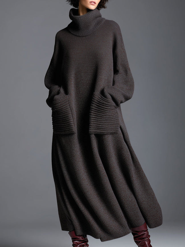 Brown knit maxi dress for women by FJØRNA, featuring a flowing silhouette and long sleeves, displayed on a model.