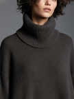 Brown knit maxi dress for women by FJØRNA, featuring a long, flowing design with a soft, textured knit fabric.