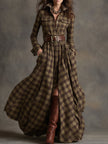 FJØRNA brown maxi casual dress with flowing fabric and long sleeves, displayed on a hanger against a neutral background.
