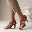 Brown FJØRNA orthopedic T-strap heeled sandals for women with supportive design and stylish heel, perfect for casual or dressy wear.