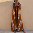 Brown FJØRNA women's elegant maxi dress with geometric V-neck, flowing fabric and stylish design perfect for formal occasions.