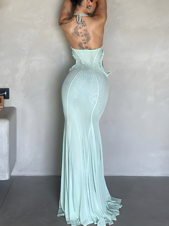 FJØRNA butterfly cut-out women's maxi dress in flowy fabric, perfect for summer and special occasions, shown on a model.