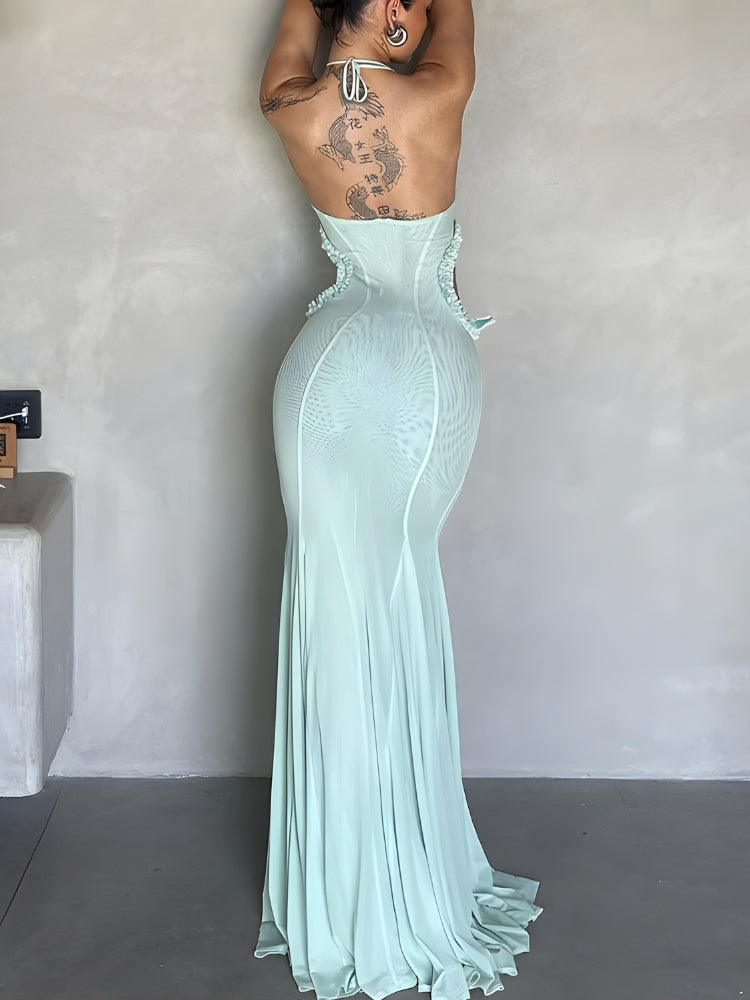 FJØRNA butterfly cut-out women's maxi dress in flowy fabric, perfect for summer and special occasions, shown on a model.