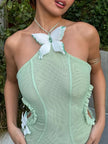 FJØRNA butterfly cut-out women's maxi dress in flowing fabric, perfect for summer and special occasions.