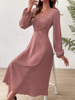 White V-neck lantern long-sleeved dress by FJØRNA, showcasing a flowing silhouette and elegant design.