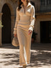 FJØRNA zipper slim fit long white dress, elegant design, close-up of the dress showcasing its fitted silhouette and front zipper detail.