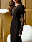 FJØRNA openwork white dress with lace slit and cinched waist, featuring intricate lace details and stylish silhouette.