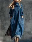 FJØRNA navy blue turtleneck dress with relaxed fit, long sleeves, and knee-length silhouette, displayed on a mannequin.