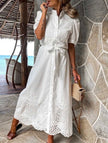 White FJØRNA pastoral style openwork embroidered dress with delicate detailing and flowing silhouette.