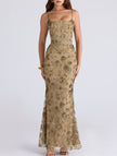 White low neck backless tie maxi dress by FJØRNA with elegant flowing fabric and stylish design for formal occasions.