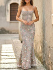 Gray backless tie maxi dress by FJØRNA featuring a low neckline and elegant flowing design, perfect for formal occasions.