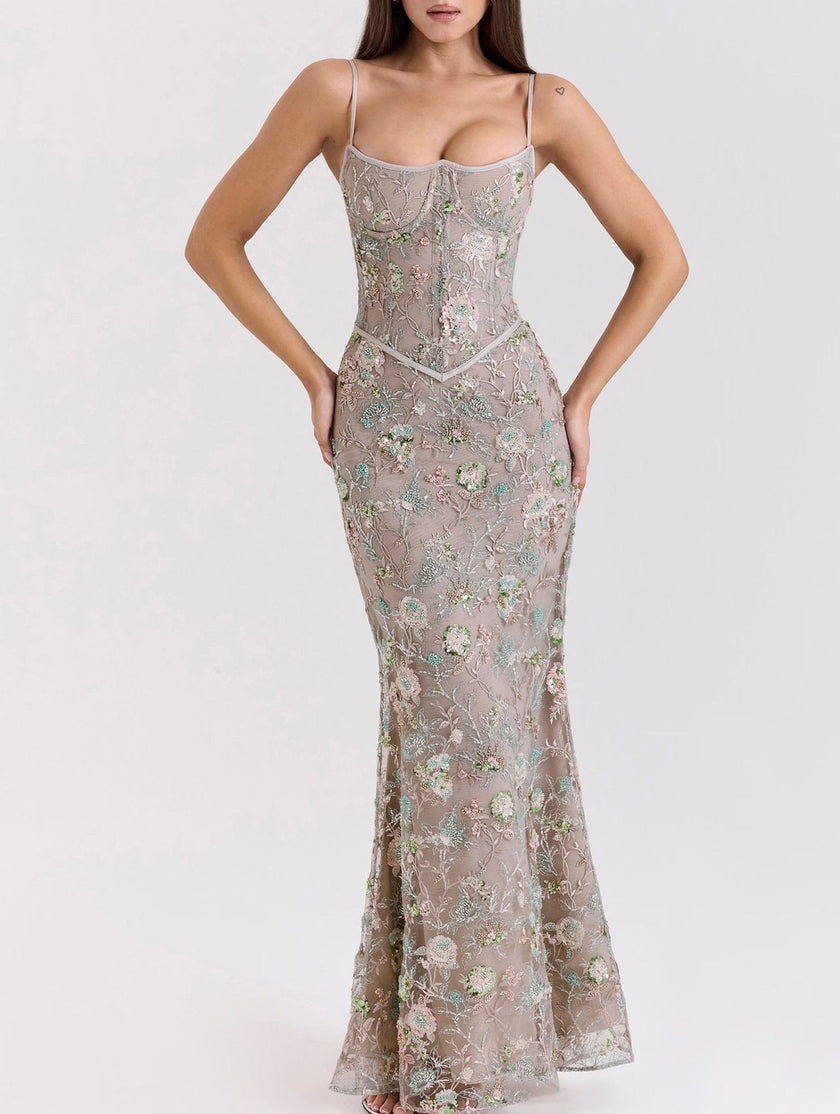 Backless white maxi dress by FJØRNA featuring a low neckline and elegant tie details, perfect for formal occasions.