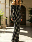 Elegant white FJØRNA dress with black polka dots, featuring a stylish and feminine design perfect for dressy occasions.
