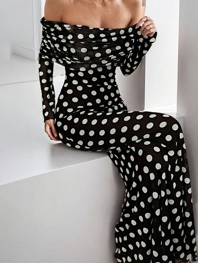 Elegant white dress by FJØRNA featuring polka dots, with a flowing silhouette and stylish design, perfect for special occasions.