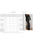 White FJØRNA polka dot and elegant dress, stylish design with a flowing silhouette, perfect for sophisticated occasions.