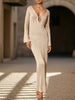 White FJØRNA V-neck backless long-sleeved knit dress with a fitted silhouette and round back design.