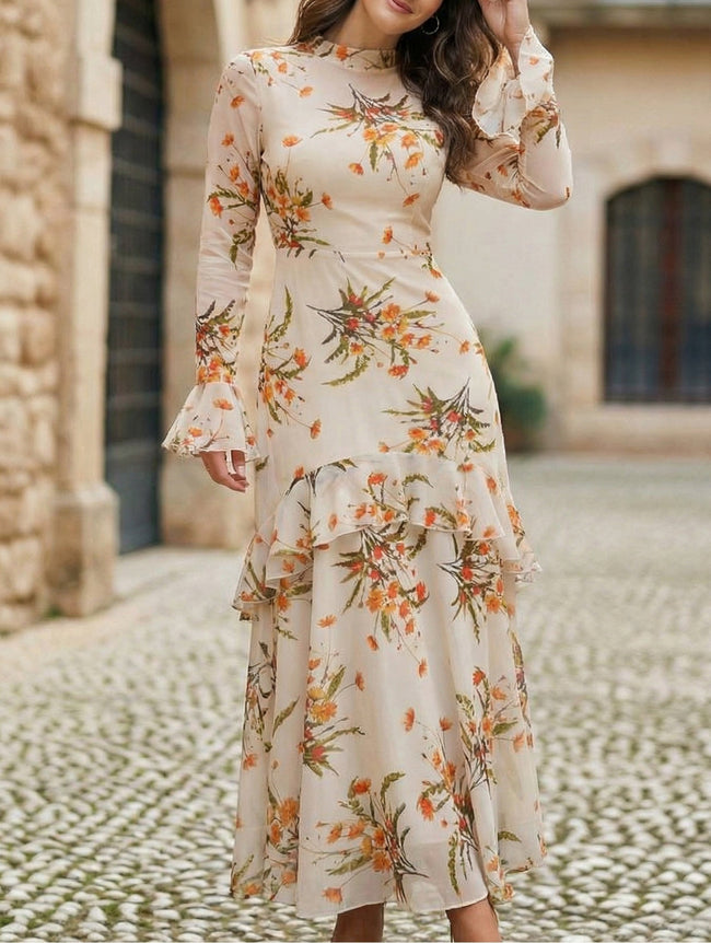 Women's white dress by FJØRNA with lotus leaf sleeves and floral print, showcasing elegant design and fabric details.