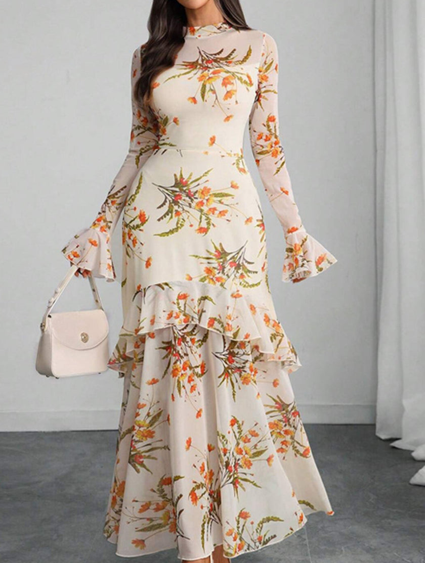 Women's white dress by FJØRNA featuring lotus leaf sleeves and floral print, shown on a model.