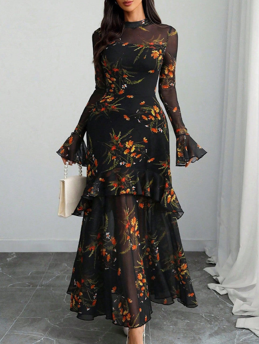 Women's white dress by FJØRNA featuring lotus leaf sleeves and floral print, styled for a feminine, elegant look.