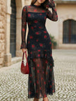 White women's dress by FJØRNA featuring lotus leaf sleeves and a floral print, shown on a mannequin.