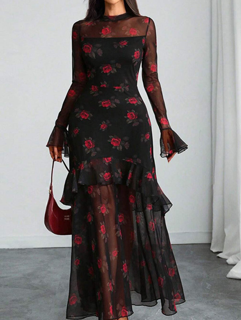 Women's white FJØRNA dress with floral print and lotus leaf sleeves, showcasing a flowing, elegant design.