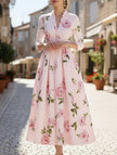 FJØRNA white V-neck waist A-line dress with a flattering silhouette, showcased on a mannequin.