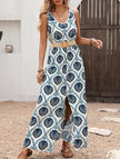 FJØRNA floral print sleeveless dress with a slit, white dress featuring vibrant blue floral patterns, perfect for summer wear.