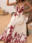White floral print backless cami maxi dress by FJØRNA, flowing design with thin straps and elegant backless style.