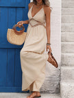 Light khaki backless sleeveless maxi dress by FJØRNA featuring an elegant, flowing design perfect for formal occasions.