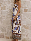 FJØRNA tropical print white cami maxi dress with colorful floral pattern, sleeveless design, lightweight fabric, perfect for summer wear.