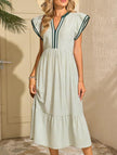 FJØRNA colorblock stripe flutter sleeve white dress with green accents, stylish and feminine, perfect for casual or semi-formal wear.