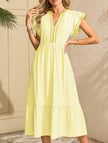 FJØRNA colorblock stripe flutter sleeve dress in white with yellow accents, showcasing a stylish and comfortable dress design.