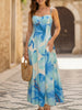 Blue floral print flowy cami maxi dress by FJØRNA, lightweight fabric, V-neck, and sleeveless design for a breezy summer look.