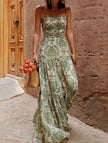 White FJØRNA cami slim fit maxi dress displayed on a hanger, showcasing its elegant and flowing design.