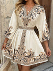 FJØRNA printed white V-neck three-quarter sleeve tie-waist dress, casual and stylish, shown on a model.