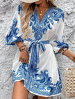 FJØRNA white printed V-neck dress with three-quarter sleeves and tie waist, perfect for casual or semi-formal occasions.