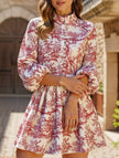 FJØRNA long-sleeved white dress with tie-print design, stylish and elegant for fashionable occasions.