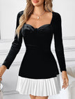 Black and white heart-shaped dress by FJØRNA, featuring classic design and elegant style, shown on a model.
