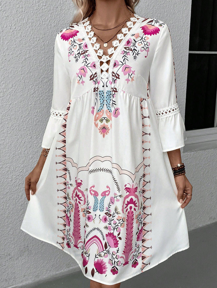 White V neck lace patch print dress by FJØRNA featuring a stylish design and elegant fabric, perfect for casual or semi-formal wear.