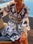 FJØRNA printed beach mini dress in white, lightweight summer dress with floral pattern, sleeveless design, ideal for warm weather.