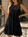 White lace patch halter A-line dress by FJØRNA, featuring a fitted bodice and flowing skirt, displayed on a dress form.