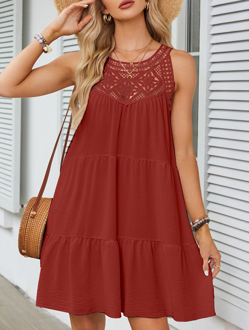 White lace patch halter A-line dress by FJØRNA, featuring a fitted bodice and flowing skirt, displayed on a mannequin.