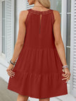 White lace patch halter A-line dress by FJØRNA, featuring a flowy silhouette and intricate lace details.