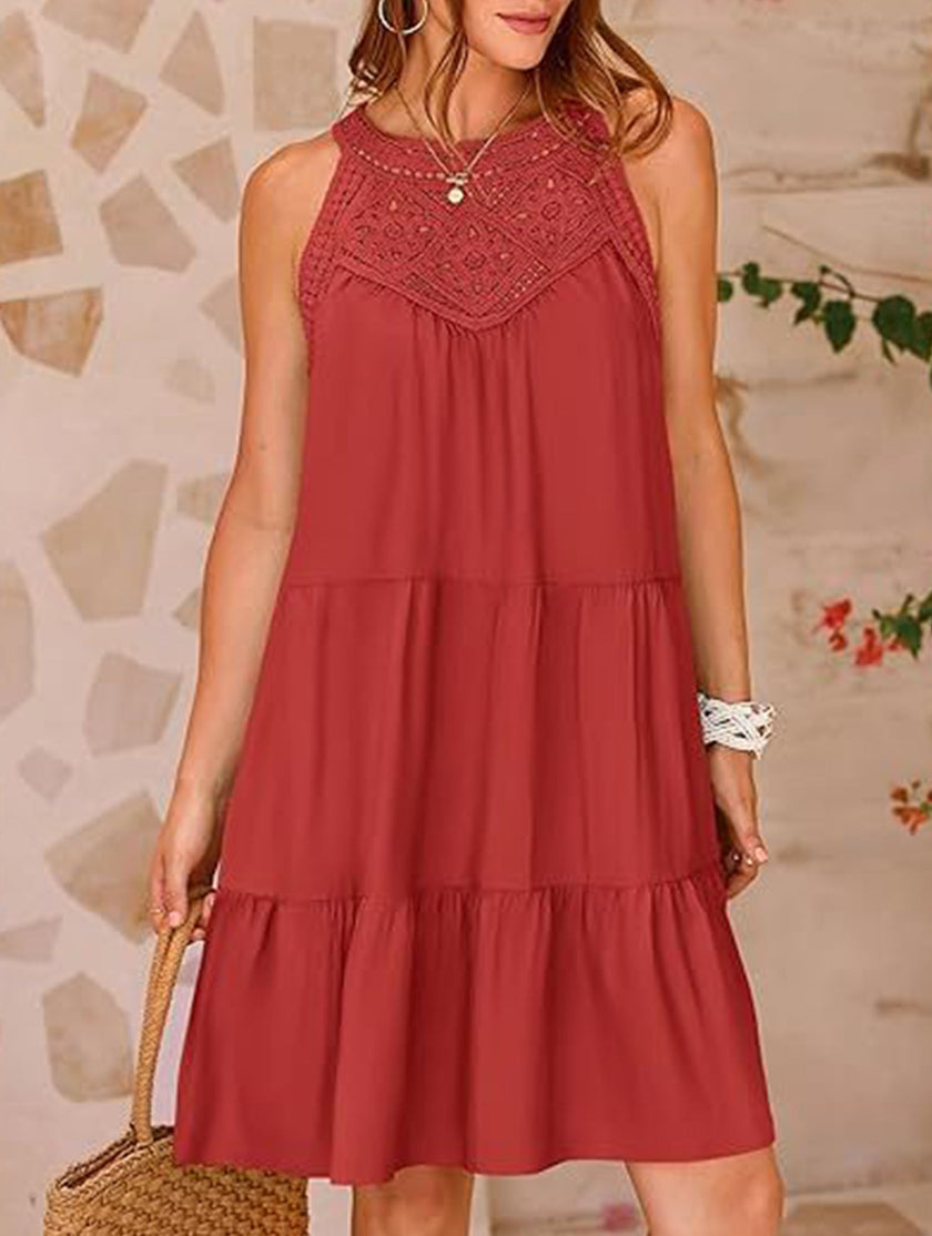 White lace patch halter A-line dress by FJØRNA, featuring a fitted bodice and flowing skirt, displayed on a mannequin.