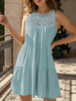 Light green lace patch halter A-line dress by FJØRNA, featuring a fitted bodice and flowy skirt, suitable for casual or formal wear.