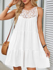White lace patch halter A-line dress by FJØRNA, featuring a fitted bodice and flowing skirt in a stylish, elegant design.