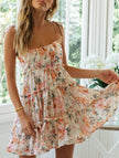 FJØRNA resort style high-end white short dress with vibrant print, perfect for summer and beach occasions.